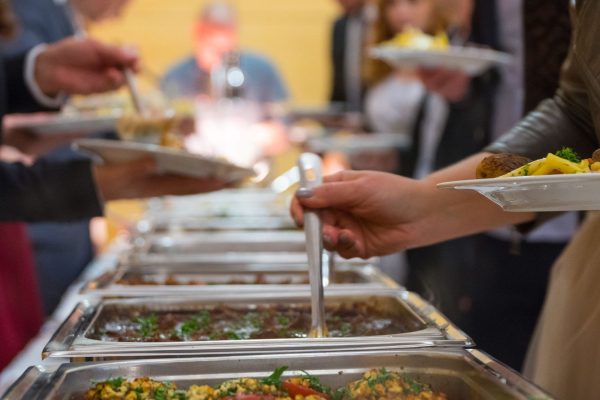people group catering buffet food indoor in luxury restaurant with meat.